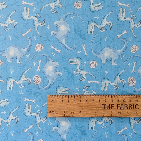 A repeating pattern of light blue dinosaurs, scattered across a blue background with small white bones and spiral shell motifs.