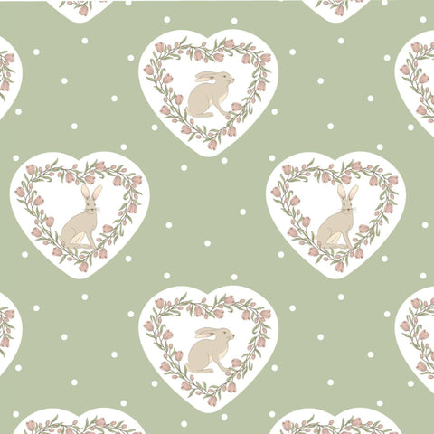 Repeating pattern of hearts with rabbits and floral wreaths on a sage green background.