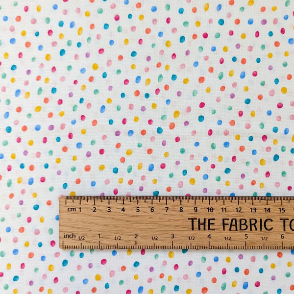 A cheerful fabric with scattered multicolored watercolor-style polka dots on a soft cream background.  Part of the Hello Spring collection from Makower.