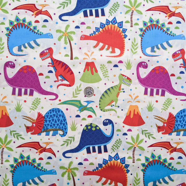 Multi coloured dinosaurs on cream background - 100% cotton - Craft Cotton Co